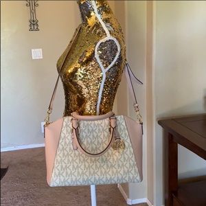 Authentic Michael Kors pink and white hand bag